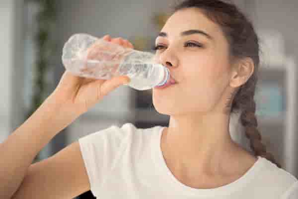 image of woman drinking water